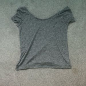 Grey t-shirt with arms that hang low.